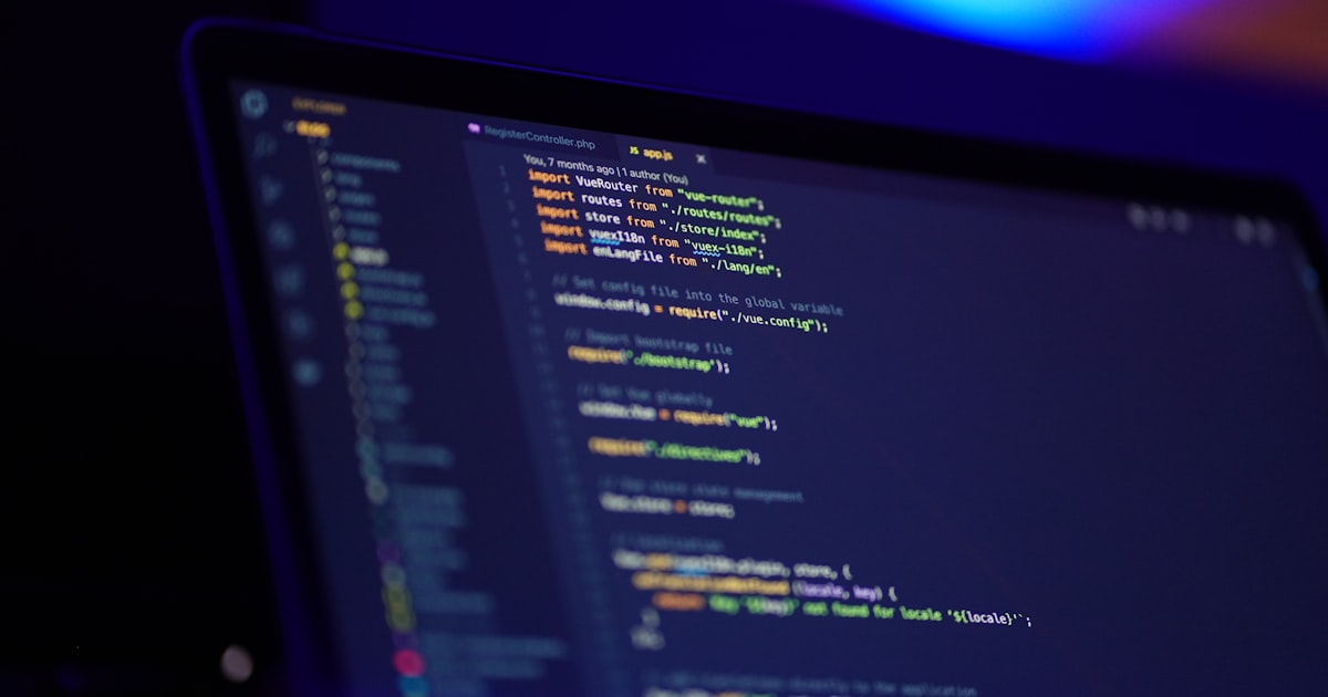Developer workspace with multiple monitors showing code and API documentation